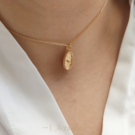 Oval hammered pendant with 1 ball